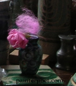 pink rosebud in blue jar with pink wool, pewter jug