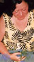 A woman cups abstract fibre objects in her hands, and unreins peripheral mental vision.